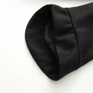 Close-up of the high-quality wool fabric texture and lining of the black peacoat