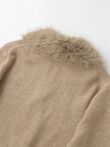 Detail of soft faux fur collar and knit texture on beige oversized sweater for women