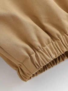 Macro detail of khaki twill fabric with ribbed elastic cuff on winter jacket