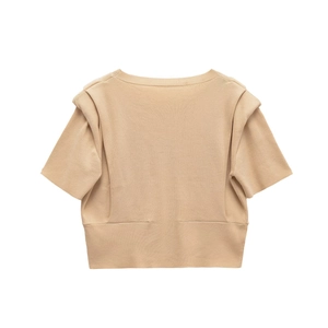 Detail view of camel short sleeve knit top with unique layered shoulder pads and round neck