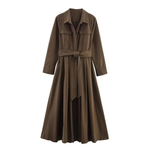 Detail of dark brown long sleeve shirt dress with lapels, pockets and adjustable waist belt