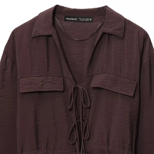 Women's dark brown long sleeve shirt with bow tie front and textured lapel design
