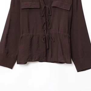Elegant chocolate satin shirt with bow-tie V-neck, pleated waist, and cargo pockets
