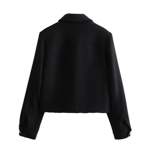 Back view of a black short jacket with textured fabric and metallic button cuff details
