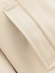 Macro detail of high-density fabric texture and neat stitching on beige trench coat pocket