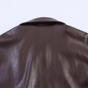 Detailed back view of a dark brown faux leather pilot jacket with textured collar