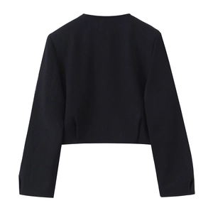 Rear view of minimalist black cropped blazer featuring clean lines and smooth fabric