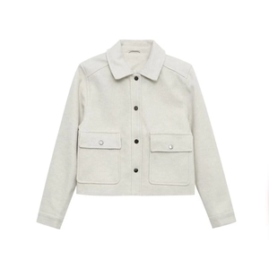 Detailed view of light gray cropped jacket with cargo pockets and black contrast snaps