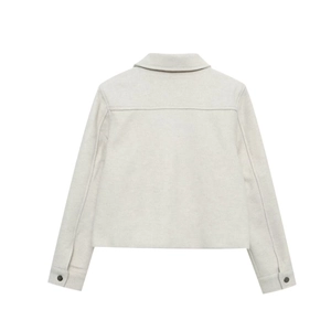 Detail view of light grey women's short jacket showing faux suede texture and back yoke seam