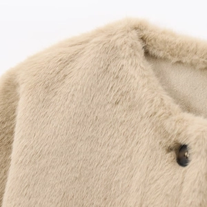 Short beige faux fur jacket for women with premium plush texture and black button detail