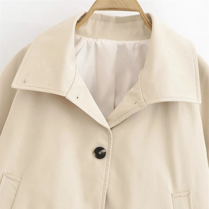 Short beige trench jacket with wide lapel and single button closure for women
