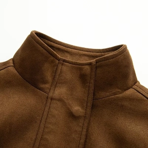 Close-up of high-quality brown faux suede fabric and stitching on motorcycle jacket collar