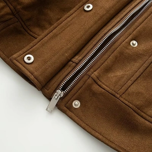 Detail of brown faux suede jacket with metallic silver zipper and snap button closure