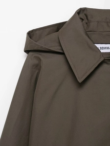 Detail view of the waterproof hooded windbreaker collar with precise stitching and label