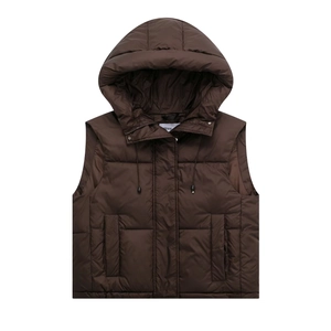 Detail of hooded down vest featuring large hood, front zipper and square flap pockets