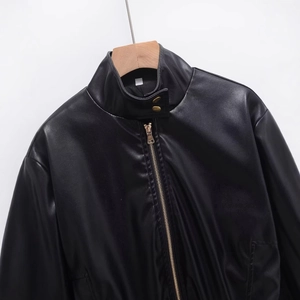 Women's chic black PU leather jacket with stand collar and gold zipper details