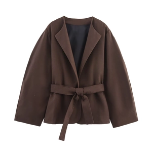 Detail view of coffee brown belted blazer with wide sleeves and smooth lining texture