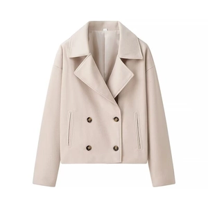 Détails de la texture du tissu beige en laine et boutons à double boutonnage
