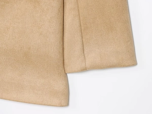 Detail of camel faux suede jacket showing premium fabric texture and neat stitching seams
