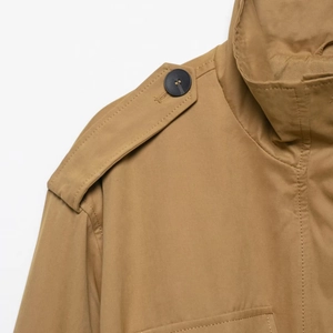 Women's khaki short trench coat with stand collar, shoulder epaulettes and waist belt