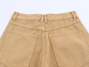 Detailed view of khaki denim pants featuring sturdy belt loops and symmetrical back pockets
