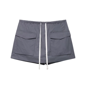 Detailed view of dark grey cargo shorts featuring elastic waist and long white drawstrings