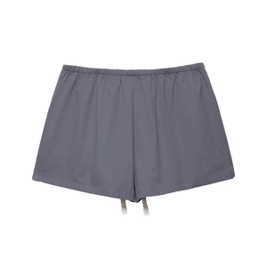 Detail of grey cotton shorts featuring elastic waistband and white adjustable drawstring
