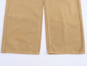Detailed macro view of khaki cotton twill pants hem with professional double-needle stitching