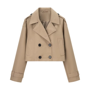 Detail of khaki cropped double-breasted trench coat with classic lapels and shoulder straps