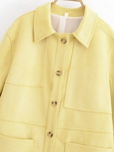 Detail of lapel suede jacket with large utility pockets and contrast stitching