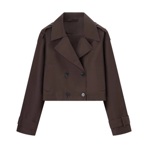 Detail of short dark coffee double-breasted trench coat with classic wide lapels and epaulettes