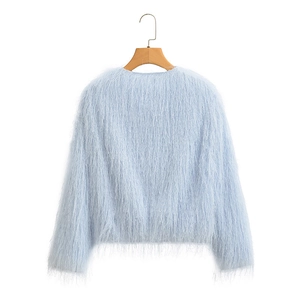 Detail of light blue faux fur long sleeve jacket with fluffy texture and round neck