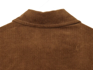 Detail of the brown corduroy jacket collar with vertical texture and fine stitching