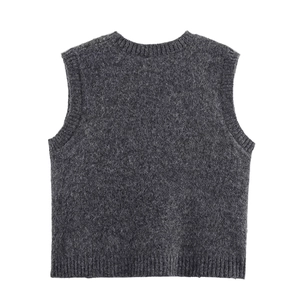 Detail of dark grey knit vest featuring ribbed edges and a textured melange wool fabric
