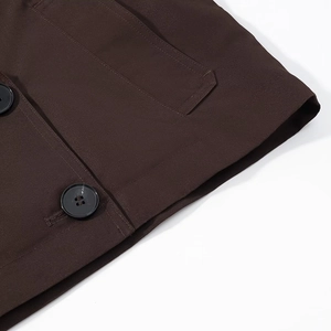Detailed view of dark coffee twill fabric and high-quality four-hole buttons on a short coat