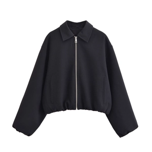 Detail of a black cropped zip-up jacket with lapel collar and metal front zipper