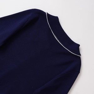 Elegant navy knit sweater with white scalloped collar and fine knit texture for women