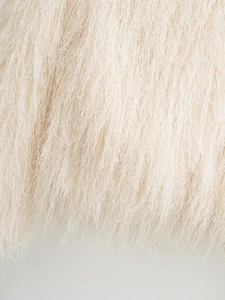 Close-up of premium white faux fur fringe detail showing soft long fiber texture
