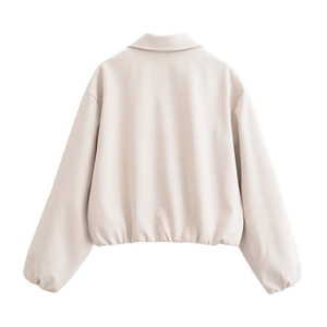 Rear view of beige short jacket featuring elasticated hem and ruffled cuffs detail
