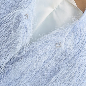 Light blue faux fur cropped jacket with soft fringe texture and metallic hook closure
