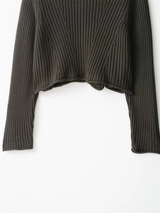 Detail of dark grey ribbed knit texture and premium fabric of this long sleeve cardigan
