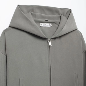 Women's minimalist dark grey hooded jacket with silver zip-up closure and side pockets