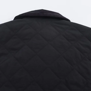 Women's black quilted jacket featuring corduroy collar and diamond stitch patterns