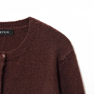 Deep burgundy crewneck knit cardigan with ribbed collar and resin button detail