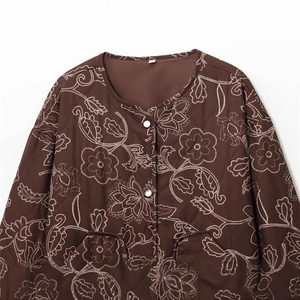Women's dark brown quilted jacket with white floral embroidery and snap buttons