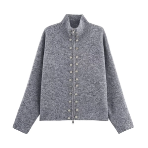Close-up of grey knitted cardigan featuring dual-way metal zippers and decorative silver buttons