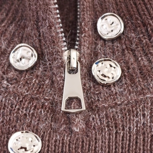 Brown knit cardigan with silver zipper and hammered metal buttons texture detail