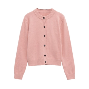 Close-up of pink knit cardigan featuring round neck and contrasting black buttons