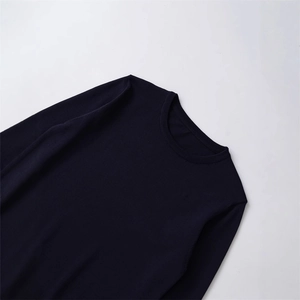 Classic crew neck knitted sweater with loose fit and textured navy blue fabric
