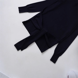 Navy knit sweater with long sleeves featuring decorative ties and ribbed cuffs on white back